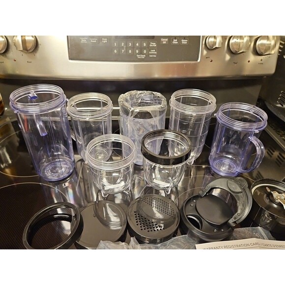 Lot Of 16 Pieces Nutribullet Assorted Cups & Lids / Tops + 1 Blade (Untested) - Picture 2 of 12